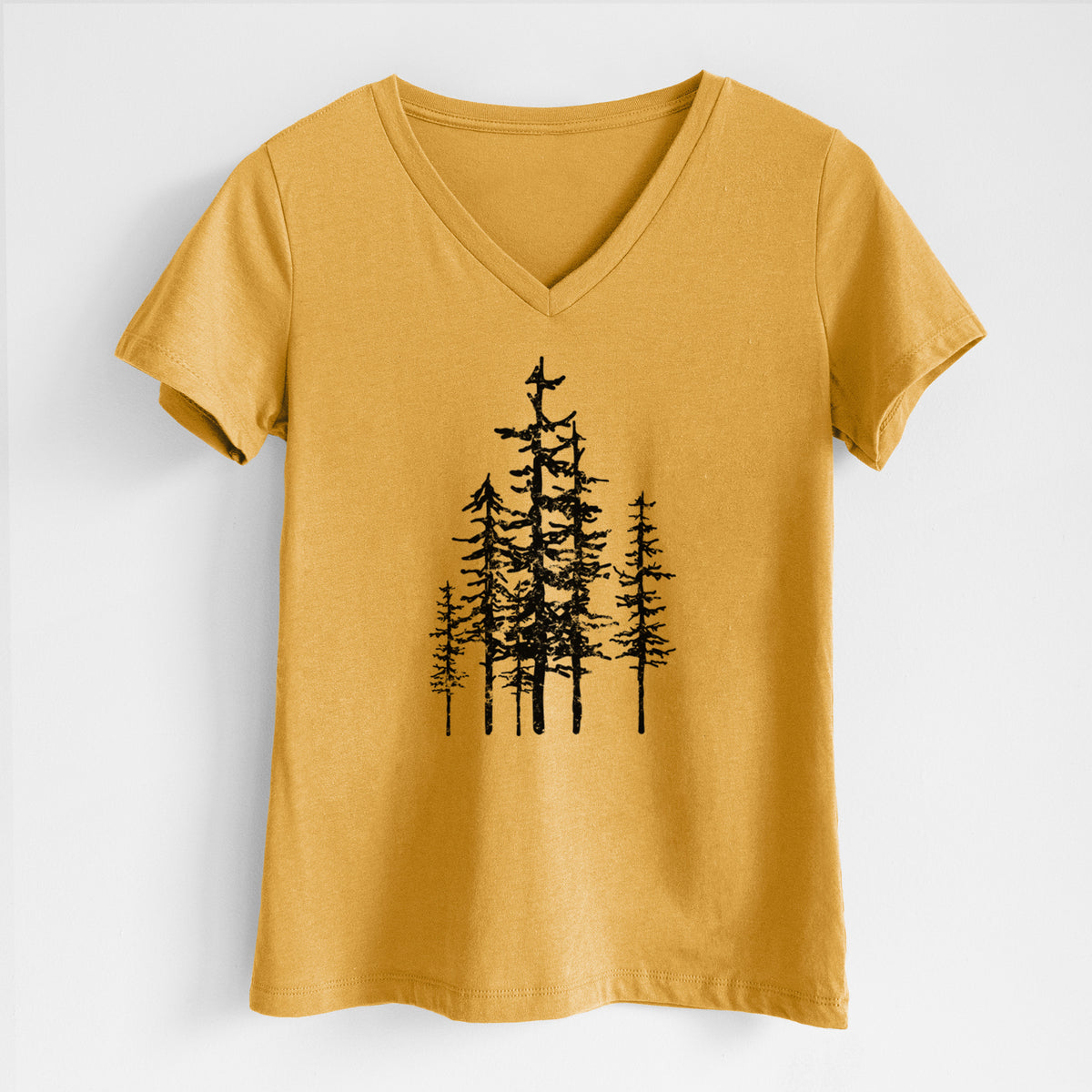 Honeycomb yellow women's relaxed fit cotton V-neck t-shirt laid flat, printed with a black ink illustration of a cluster of evergreen trees of varying heights.