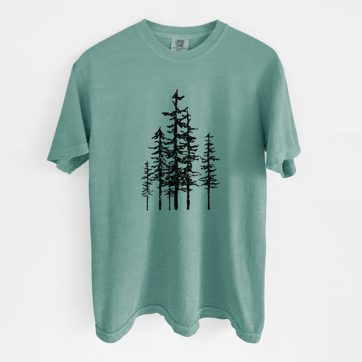 Reef green Comfort Colors t-shirt laid flat, printed with a black ink illustration of a cluster of evergreen trees of varying heights.