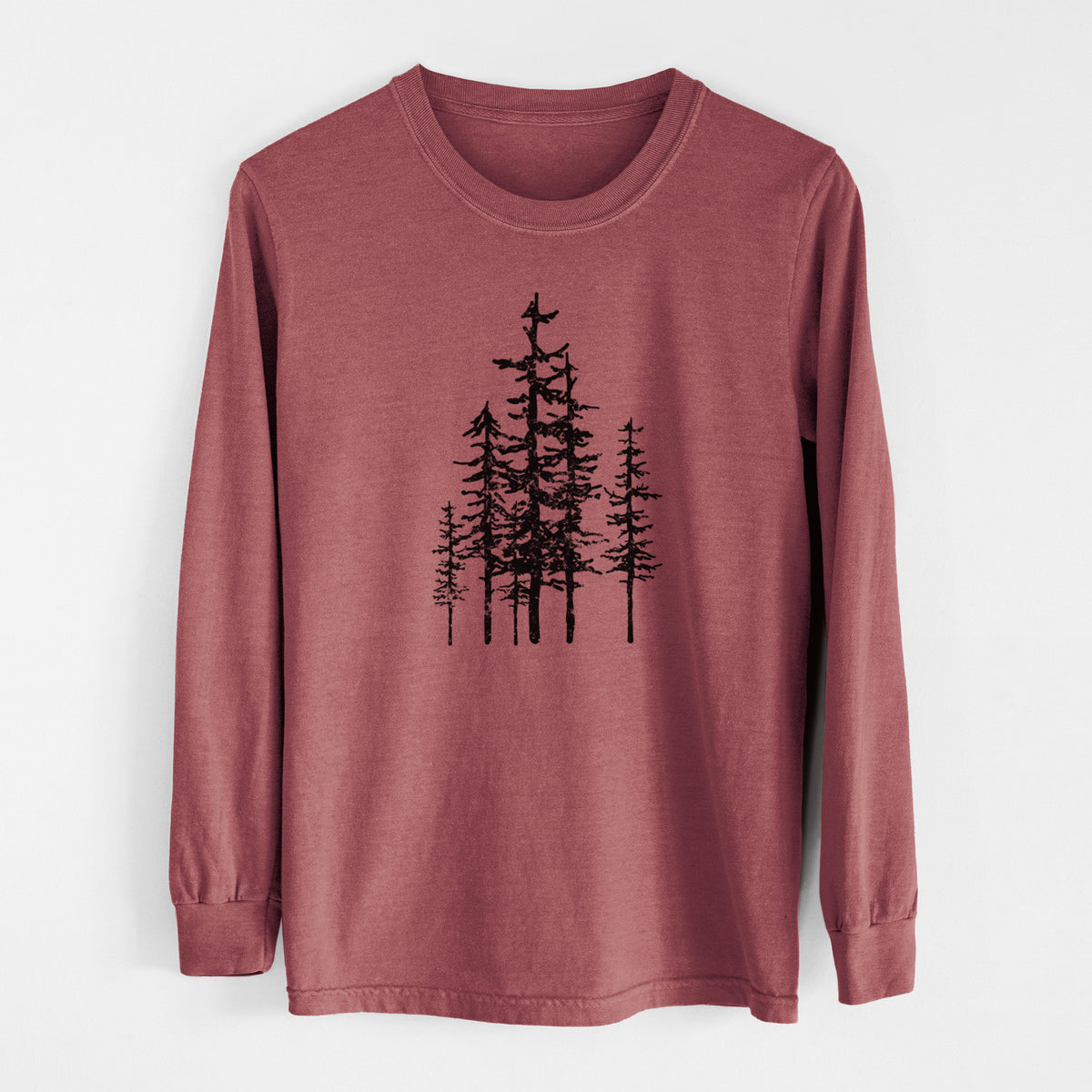 Brick red Comfort Colors long sleeve shirt laid flat, printed with a black ink illustration of a cluster of evergreen trees of varying heights.