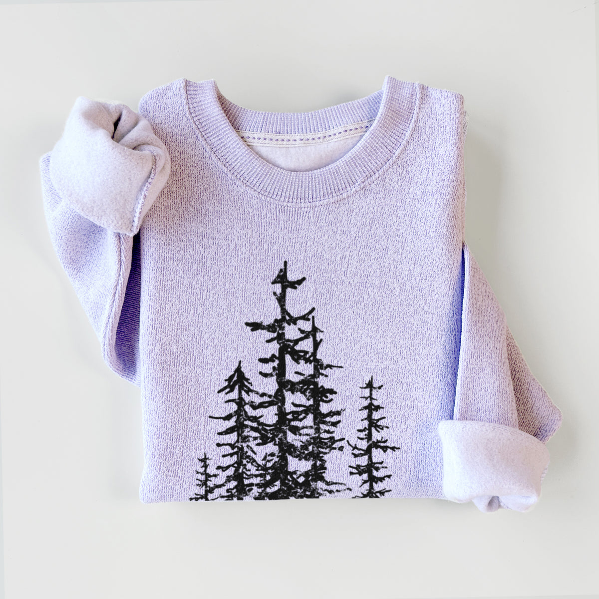 Ice purple knit sweatshirt printed with a black ink illustration of a cluster of evergreen trees of varying heights, styled flat.