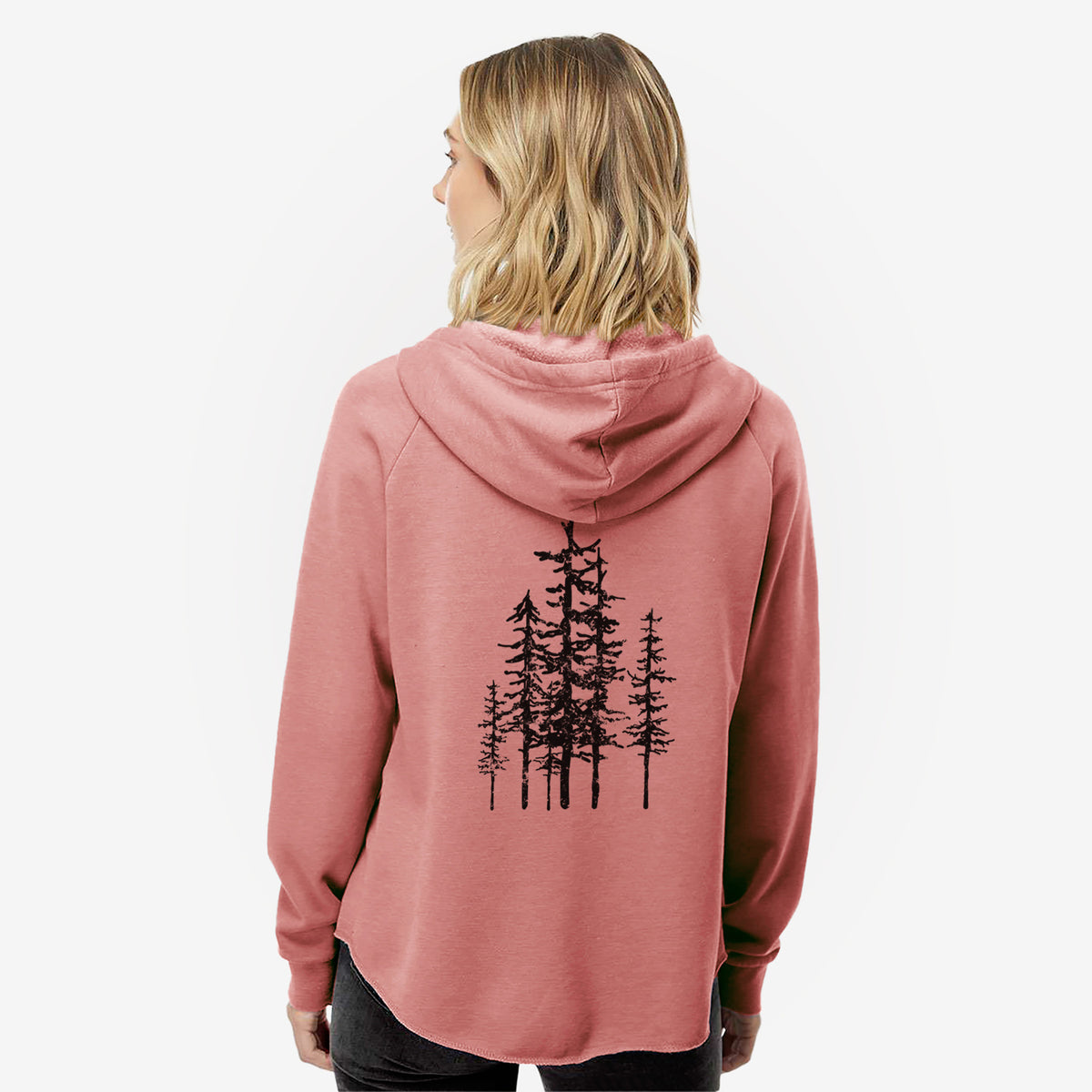 Woman wearing a dusty rose women's Cali Wave zip-up sweatshirt printed with a black ink illustration of a cluster of evergreen trees of varying heights, seen from behind.