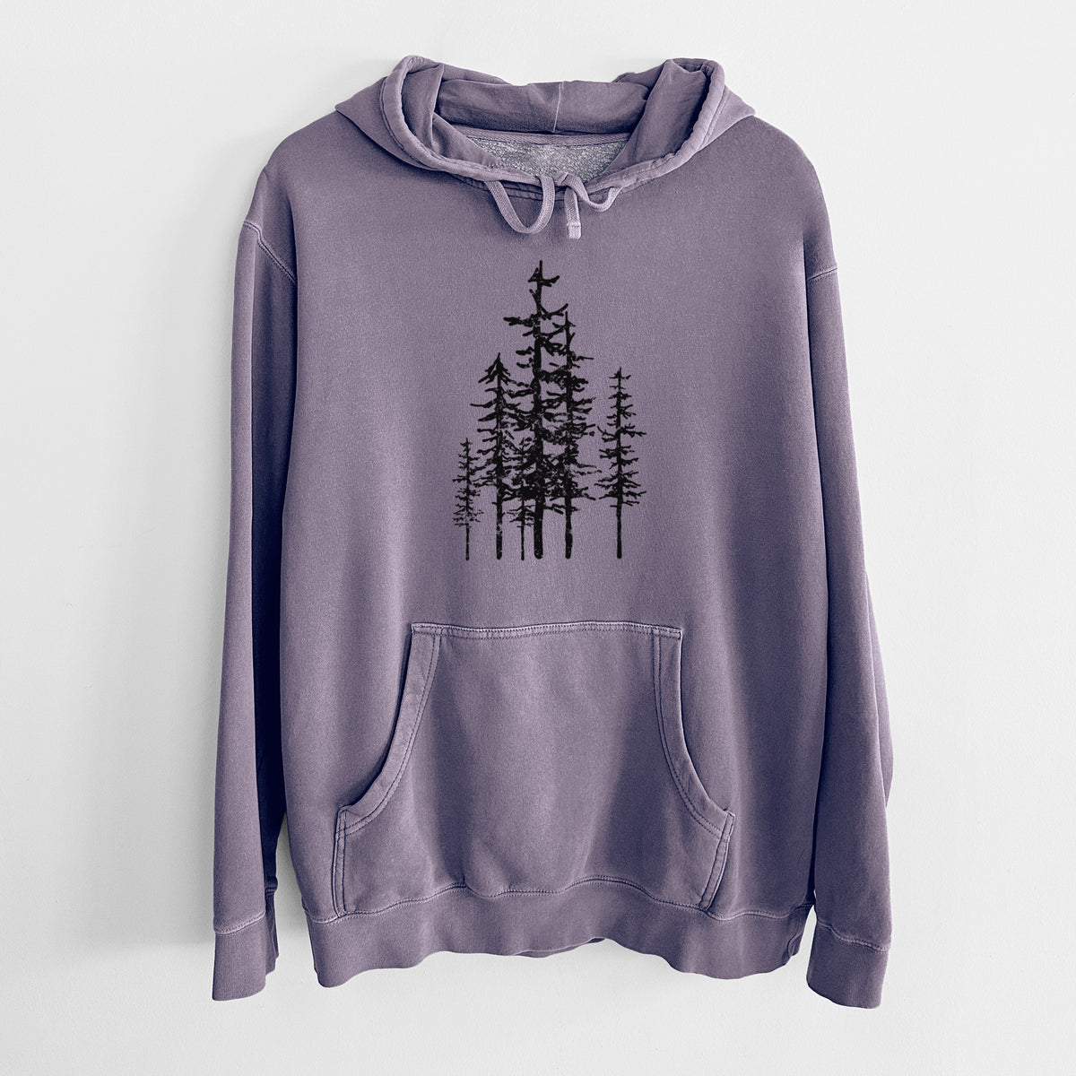 Plum purple pigment dyed hoodie laid flat, printed with a black ink illustration of a cluster of evergreen trees of varying heights.