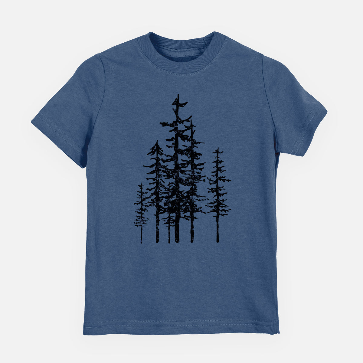 Indigo blue youth t-shirt laid flat, printed with a black ink illustration of a cluster of evergreen trees of varying heights.