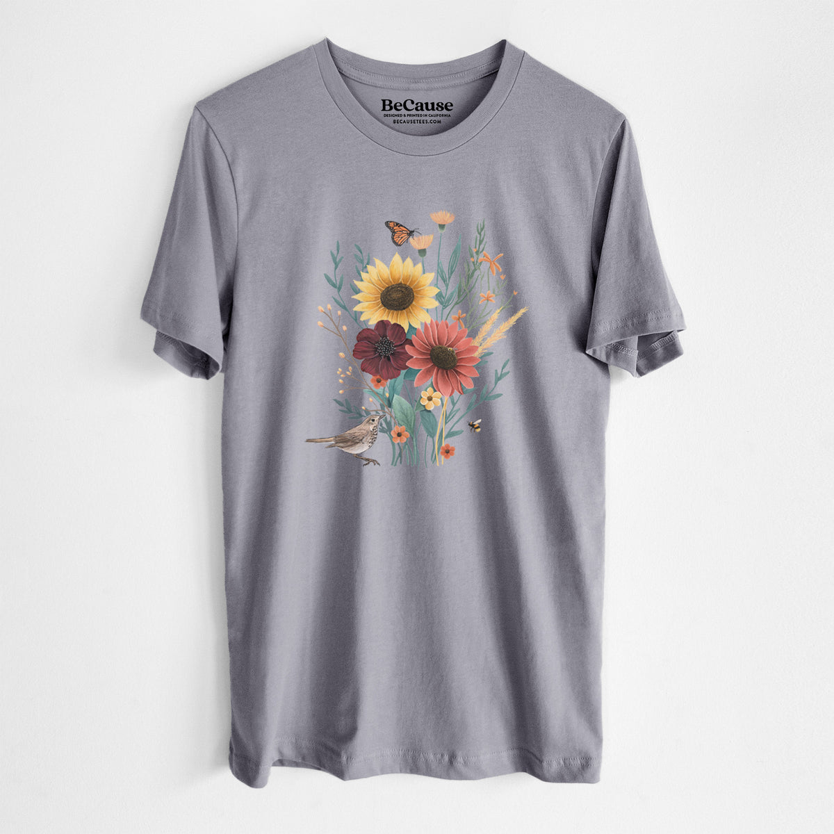 Storm grey lightweight cotton t-shirt laid flat, printed with a full-color bouquet of sunflowers, red flowers and wildflowers with butterflies and a small bird.