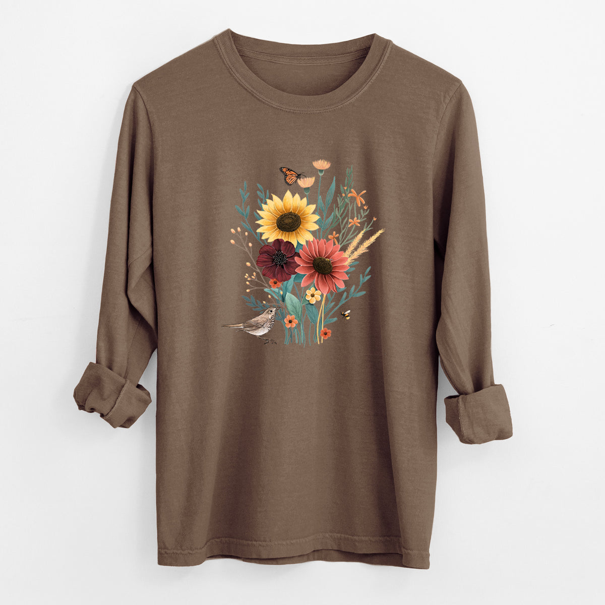 Espresso brown Comfort Colors long sleeve shirt laid flat with the cuffs rolled, printed with a full-color bouquet of sunflowers, red flowers and wildflowers with butterflies and a small bird.
