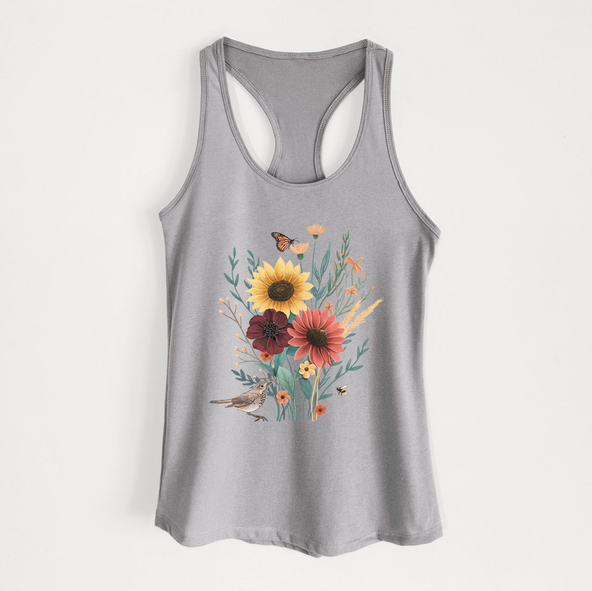 Heather grey women's racerback tank top laid flat, printed with a full-color bouquet of sunflowers, red flowers and wildflowers with butterflies and a small bird.