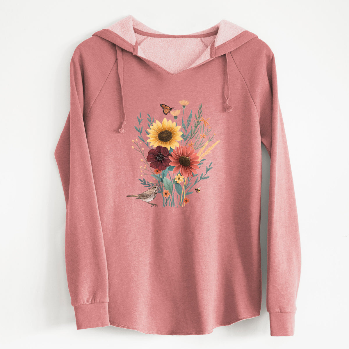 Dusty rose women's Cali Wave hooded sweatshirt laid flat, printed with a full-color bouquet of sunflowers, red flowers and wildflowers with butterflies and a small bird.
