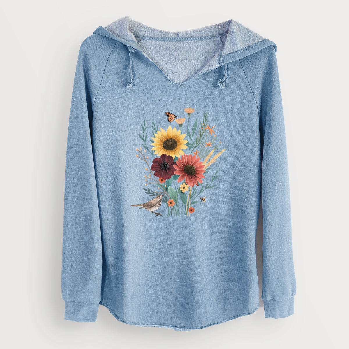 Misty blue women's Cali Wave hooded sweatshirt laid flat, printed with a full-color bouquet of sunflowers, red flowers and wildflowers with butterflies and a small bird.