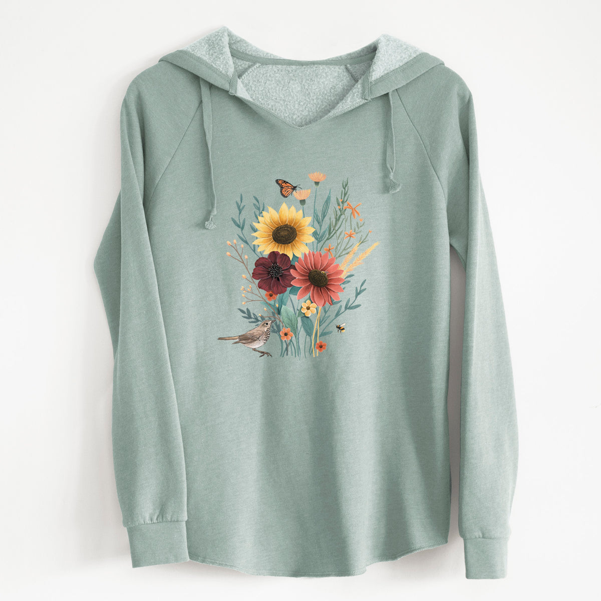 Sage green women's Cali Wave hooded sweatshirt laid flat, printed with a full-color bouquet of sunflowers, red flowers and wildflowers with butterflies and a small bird.