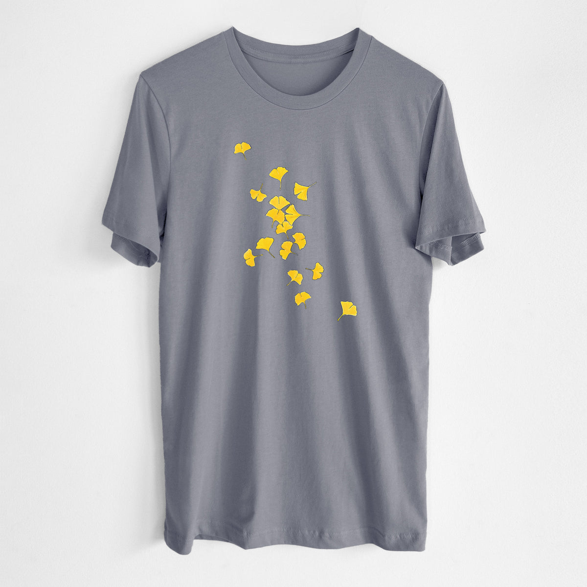 Storm grey lightweight cotton t-shirt laid flat, printed with a scatter of bright yellow fan-shaped ginkgo leaves falling.