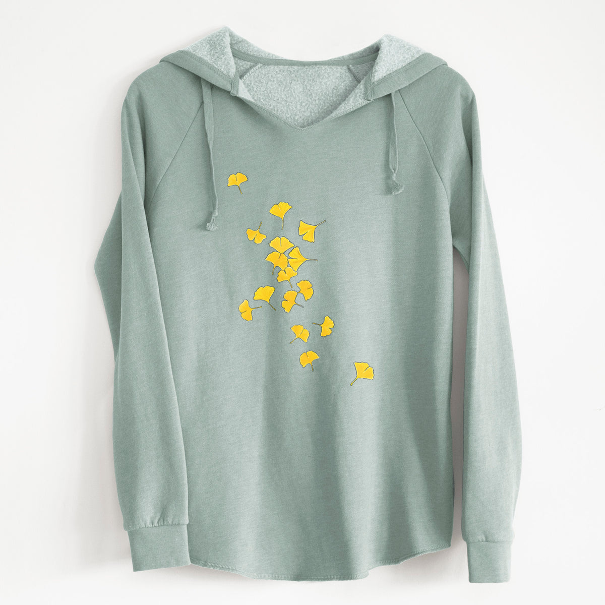 Sage green women's Cali Wave hooded sweatshirt laid flat, printed with a scatter of bright yellow fan-shaped ginkgo leaves falling.