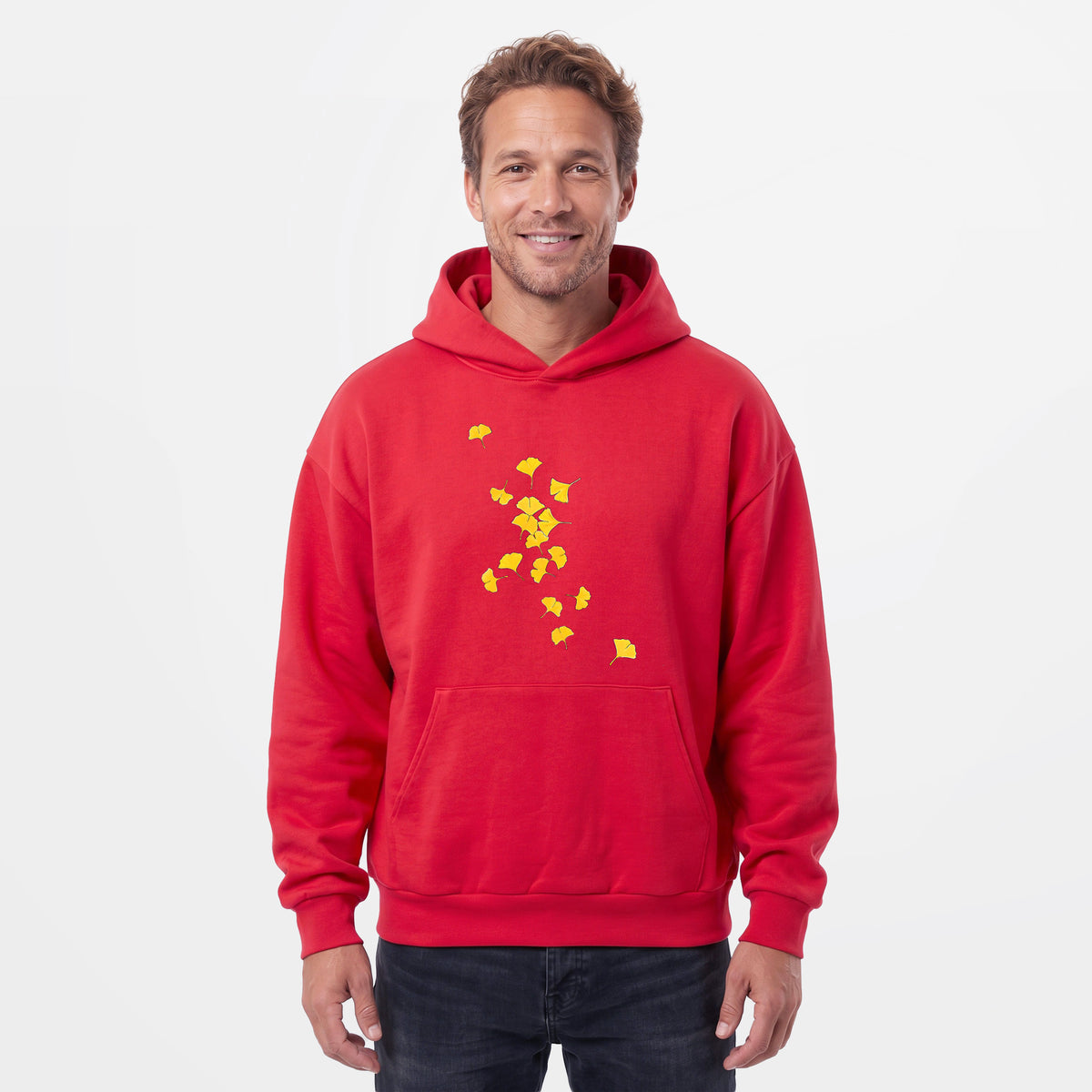 Male model wearing the Falling Ginkgo Leaves - Statement Midweight Hoodie.