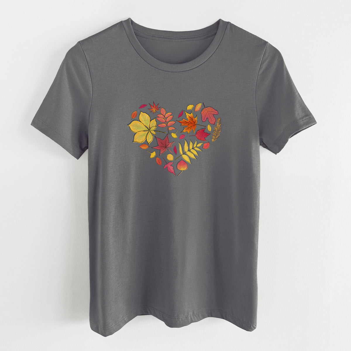 Asphalt women's relaxed fit cotton t-shirt laid flat, printed with a full-color heart shape made of autumn leaves in orange, red and yellow.