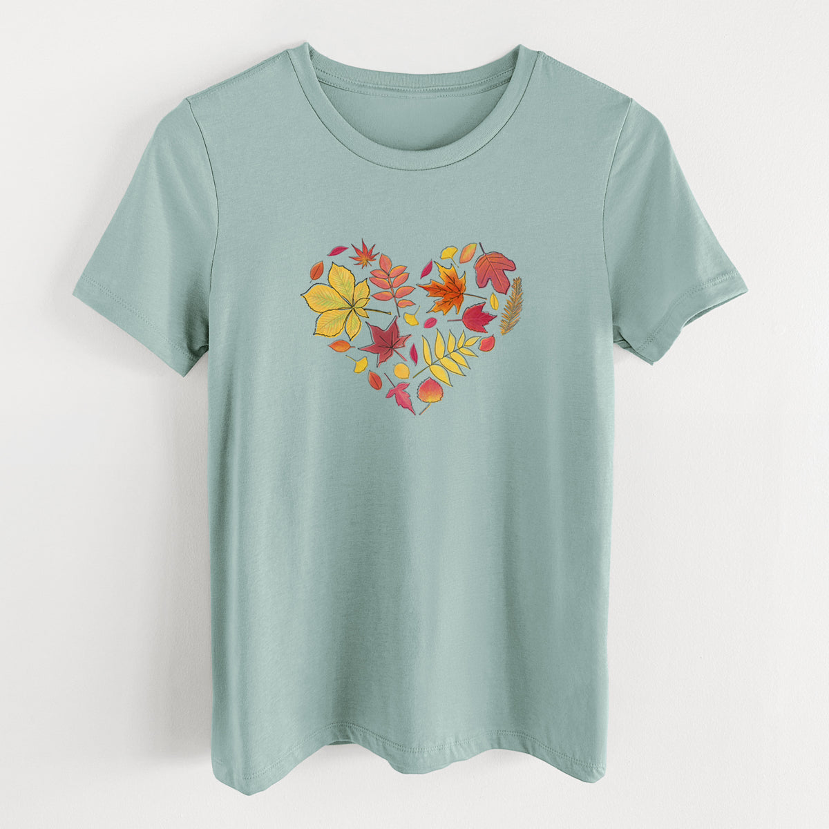Dusty blue women's relaxed fit cotton t-shirt laid flat, printed with a full-color heart shape made of autumn leaves in orange, red and yellow.