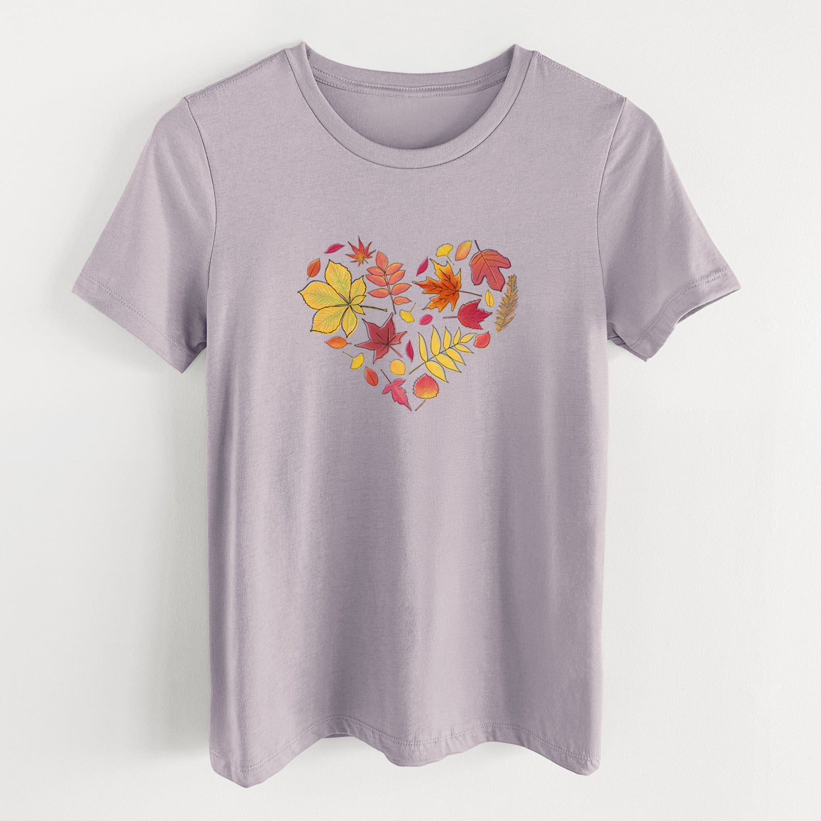 Light violet women's relaxed fit cotton t-shirt laid flat, printed with a full-color heart shape made of autumn leaves in orange, red and yellow.