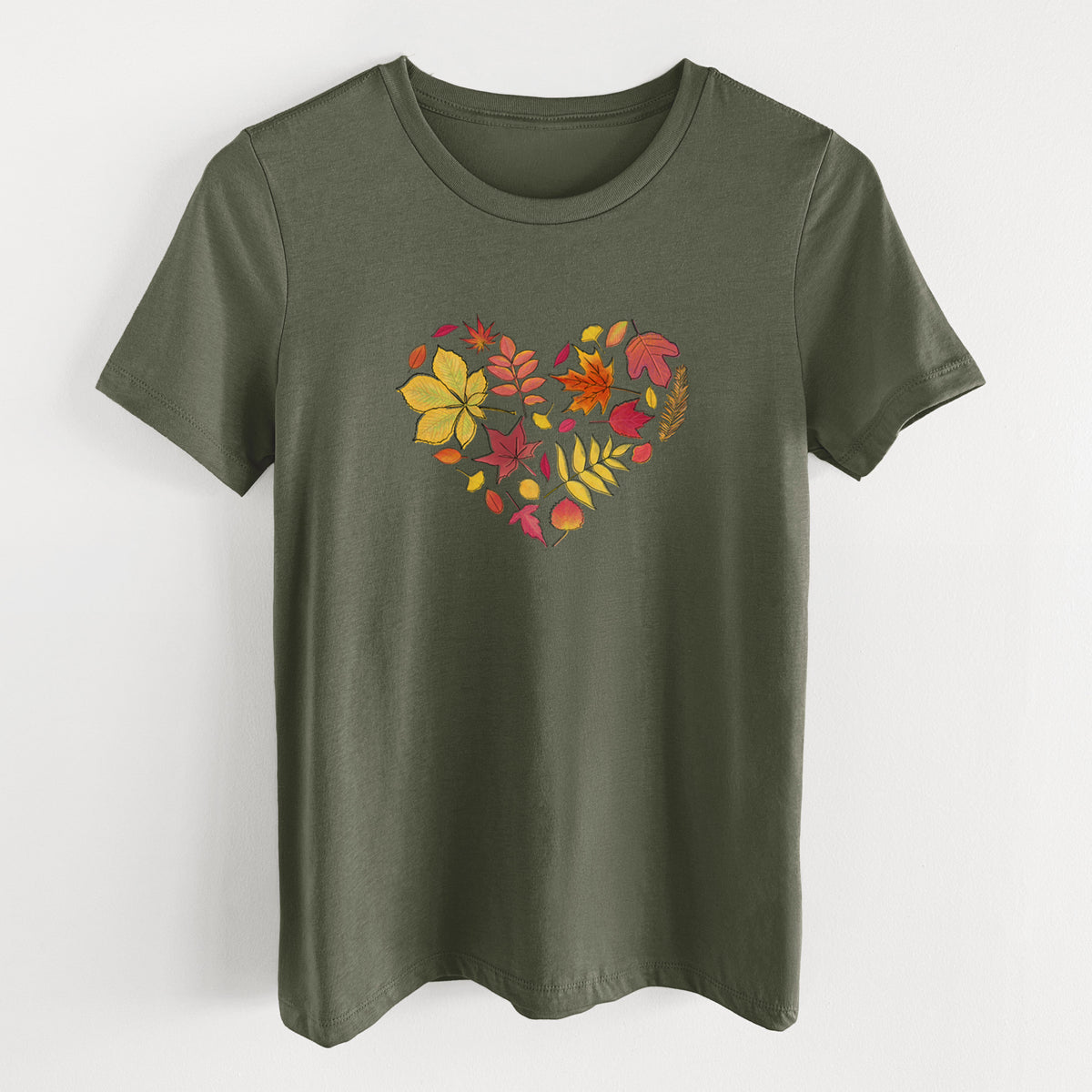Military green women's relaxed fit cotton t-shirt laid flat, printed with a full-color heart shape made of autumn leaves in orange, red and yellow.