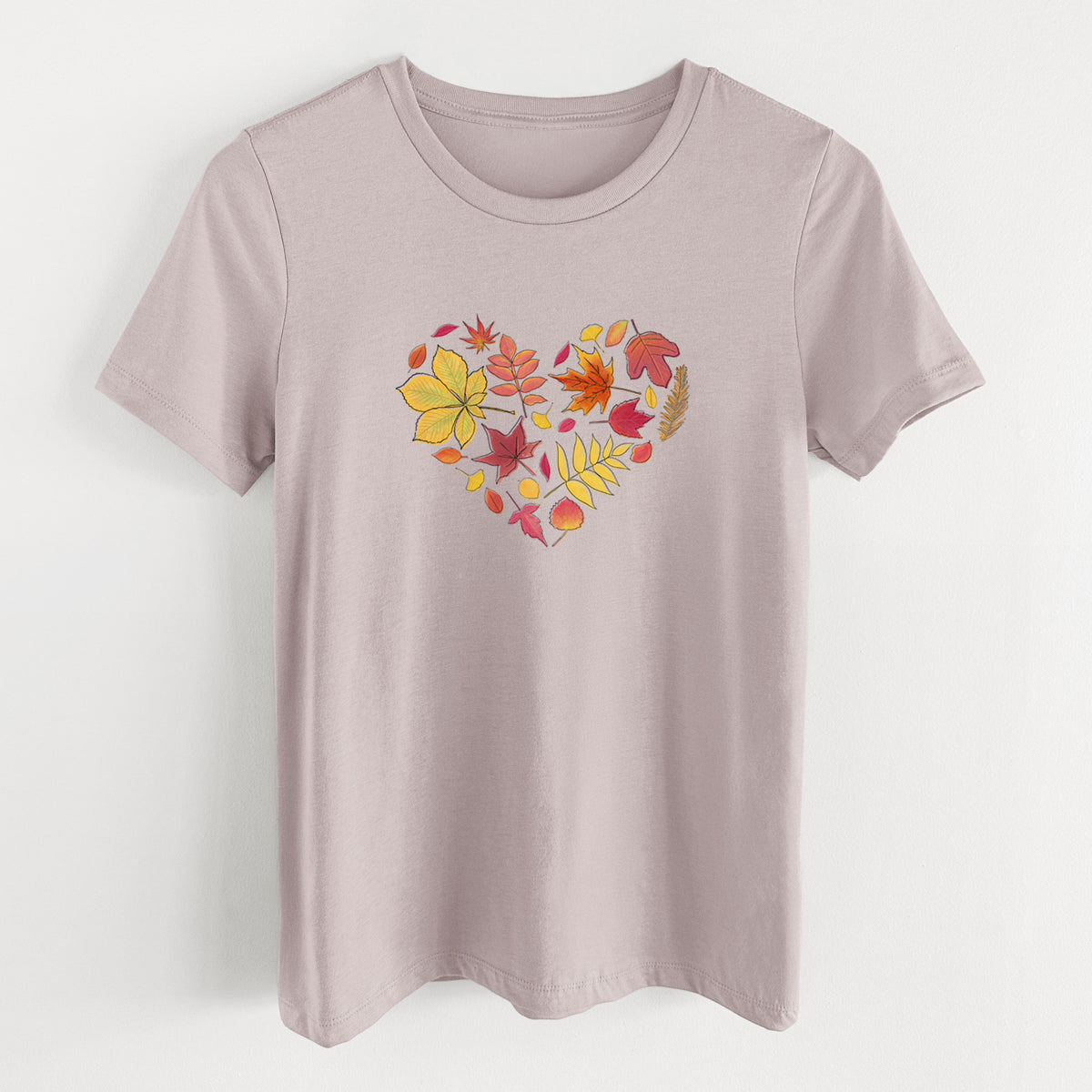Pink gravel women's relaxed fit cotton t-shirt laid flat, printed with a full-color heart shape made of autumn leaves in orange, red and yellow.