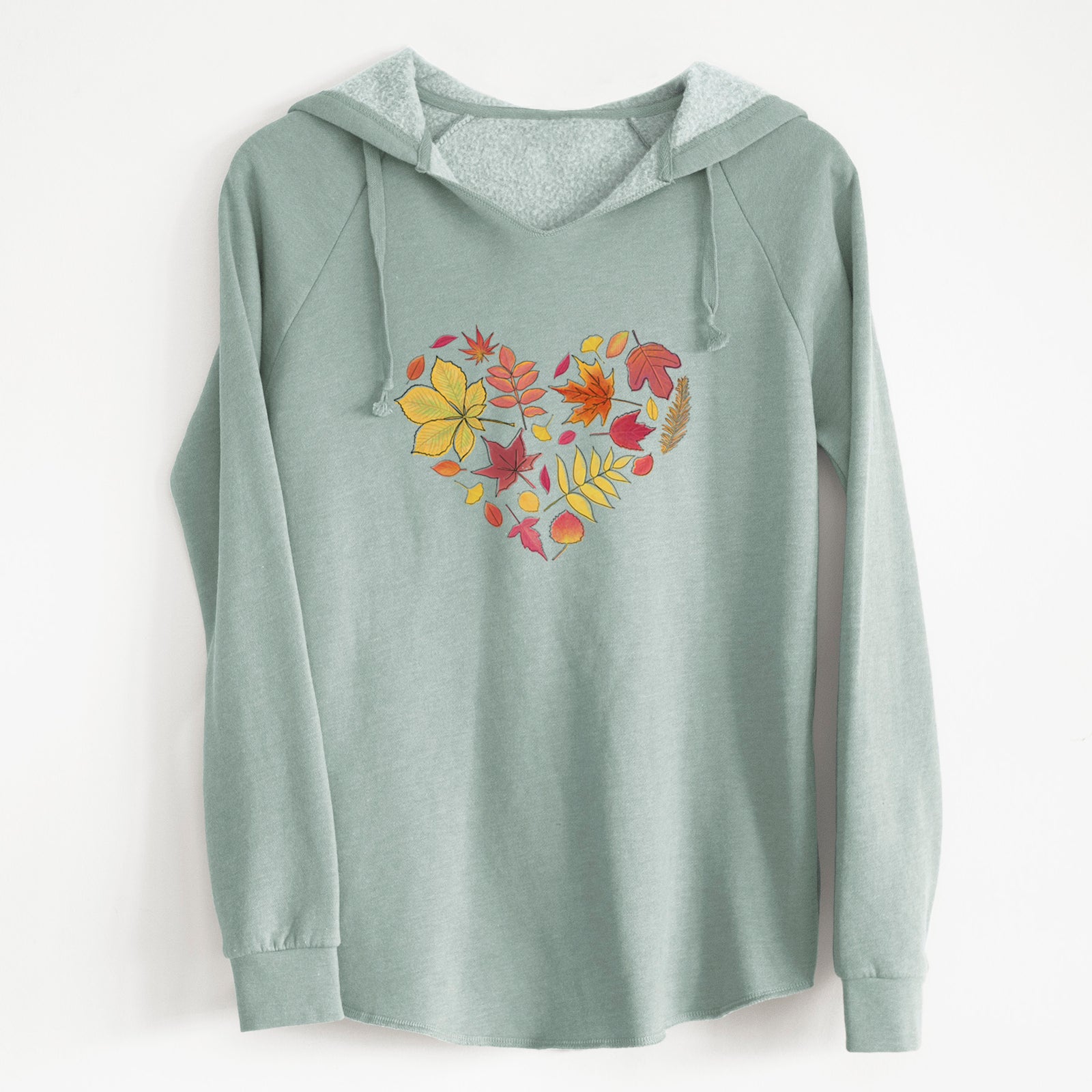 Sage green women's Cali Wave hooded sweatshirt laid flat, printed with a full-color heart shape made of autumn leaves in orange, red and yellow.