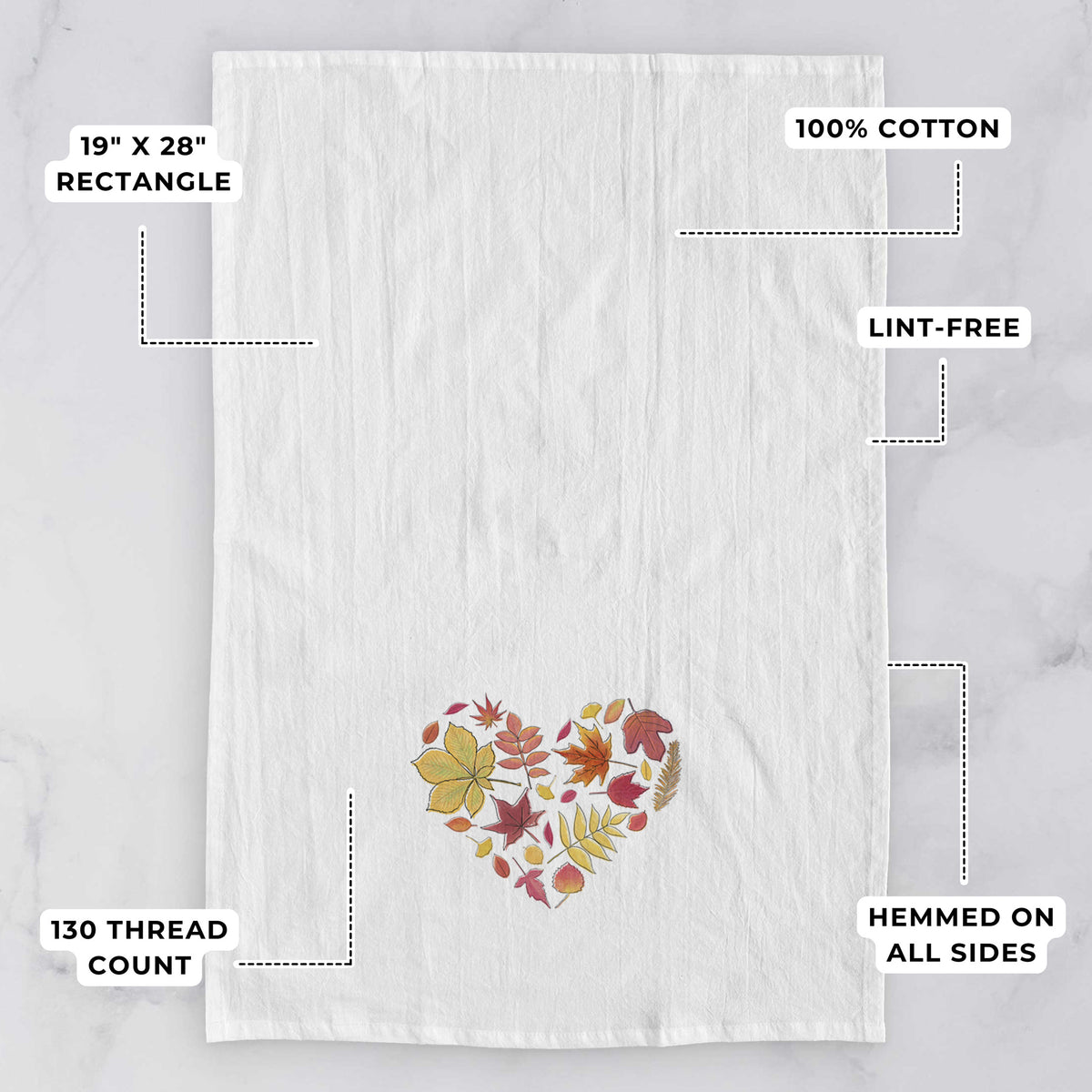White tea towel printed with a full-color heart shape made of autumn leaves in orange, red and yellow, with feature labels: 19 by 28 inch rectangle, 100% cotton, lint-free, 130 thread count, hemmed on all sides.