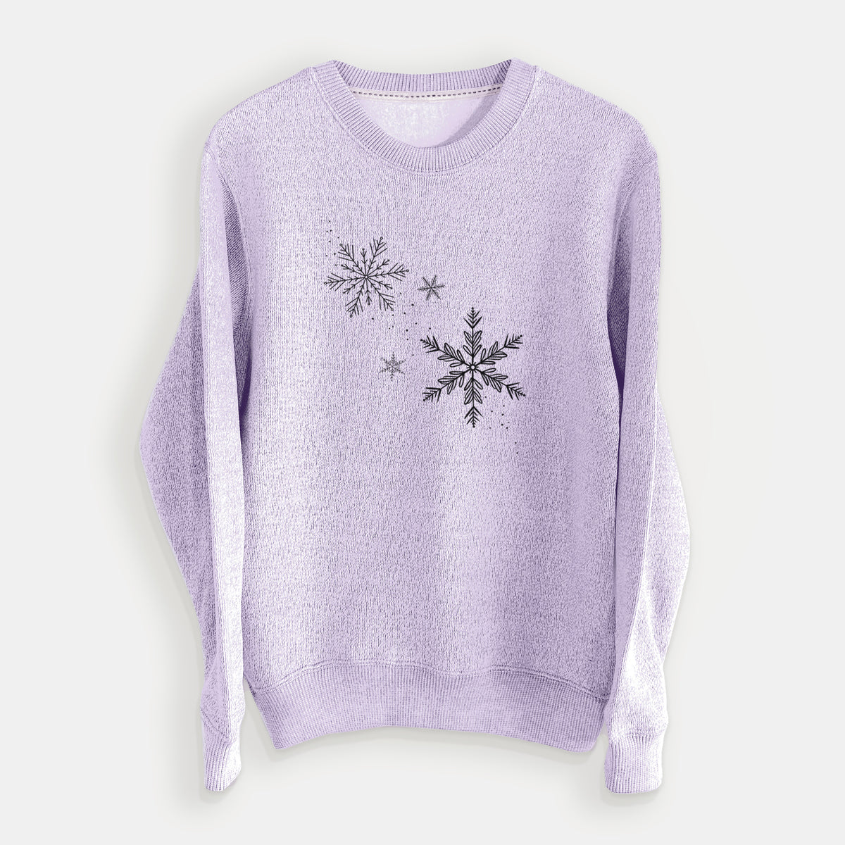 Ice purple knit sweatshirt laid flat, printed with delicate snowflakes of different sizes falling.