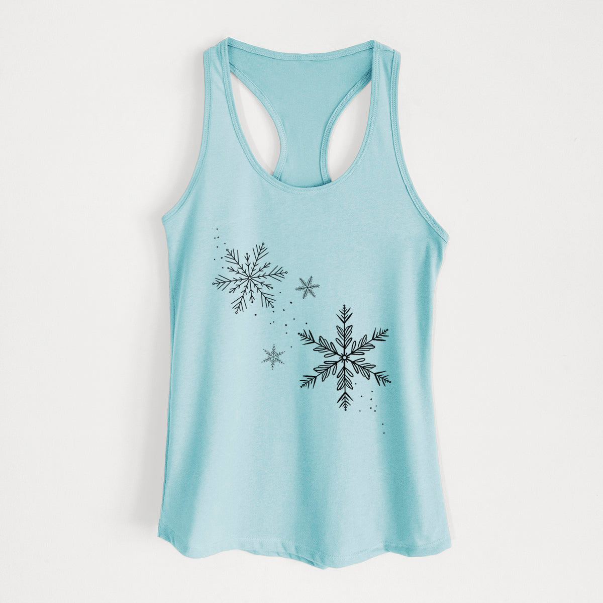 Cancun blue women's racerback tank top laid flat, printed with delicate snowflakes of different sizes falling.