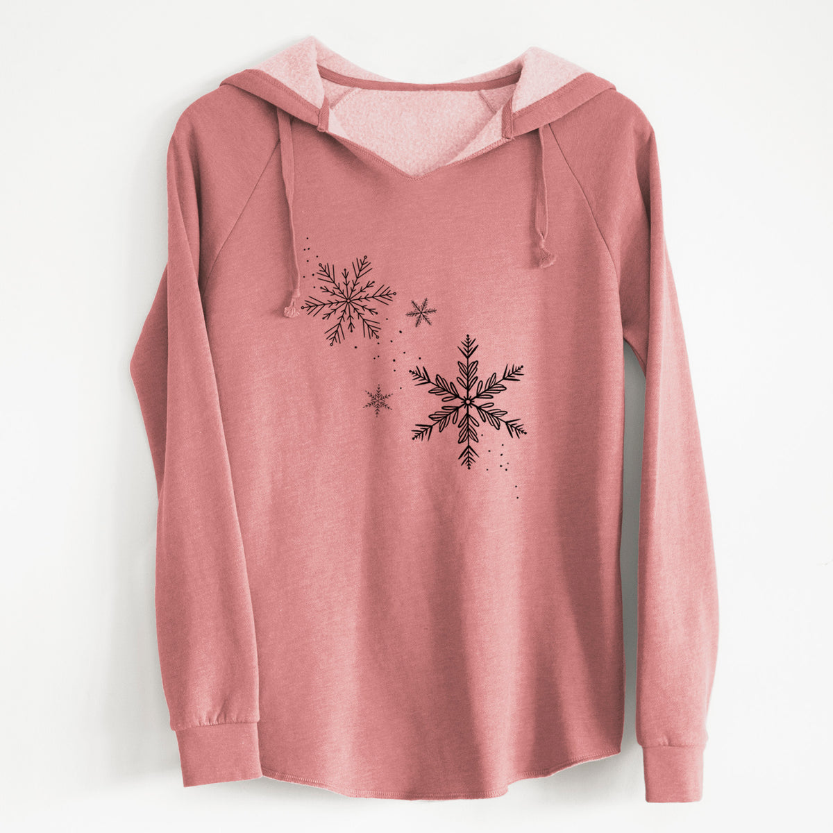 Dusty rose women's Cali Wave hooded sweatshirt laid flat, printed with delicate snowflakes of different sizes falling.