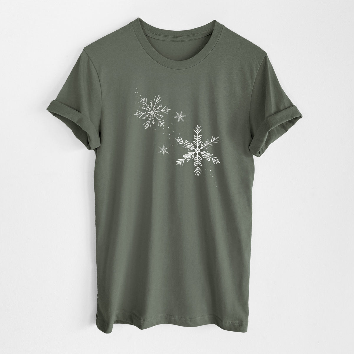 Military green lightweight cotton t-shirt laid flat, printed with delicate white snowflakes of different sizes falling.