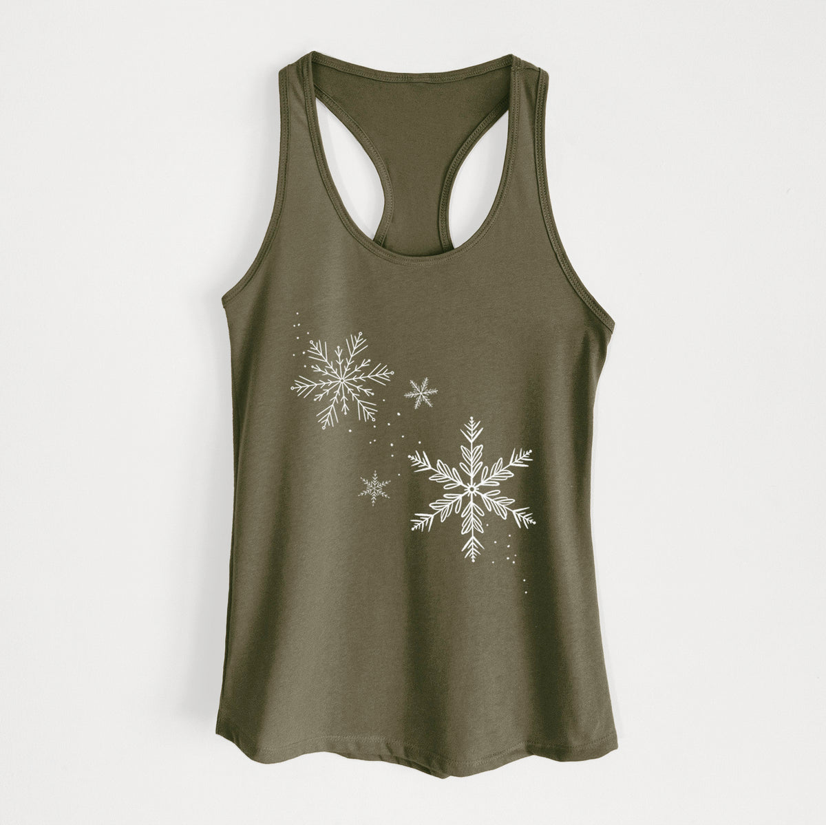 Military green women's racerback tank top laid flat, printed with delicate white snowflakes of different sizes falling.
