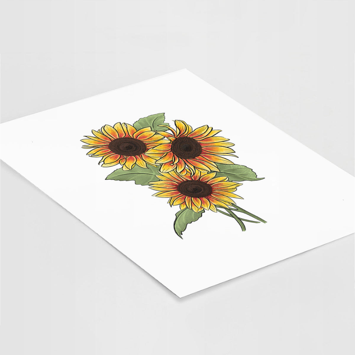 Art print of a full-color illustration of a bunch of yellow and orange sunflowers, lying at an angle on a white surface.