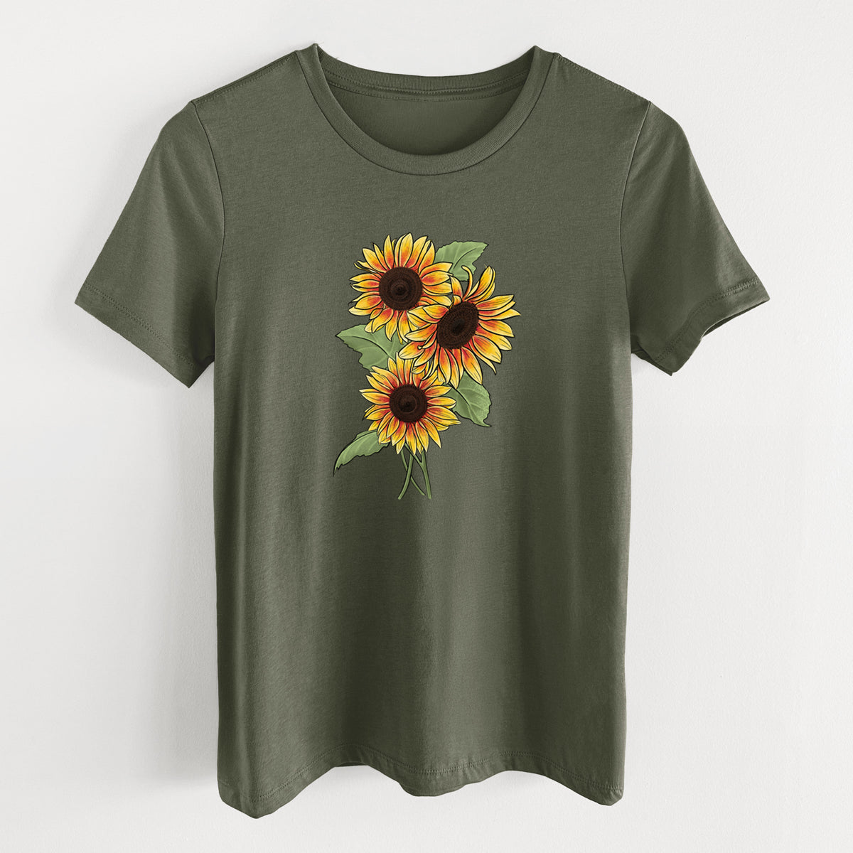 Military green women's relaxed fit cotton t-shirt laid flat, printed with a full-color illustration of a bunch of yellow and orange sunflowers.