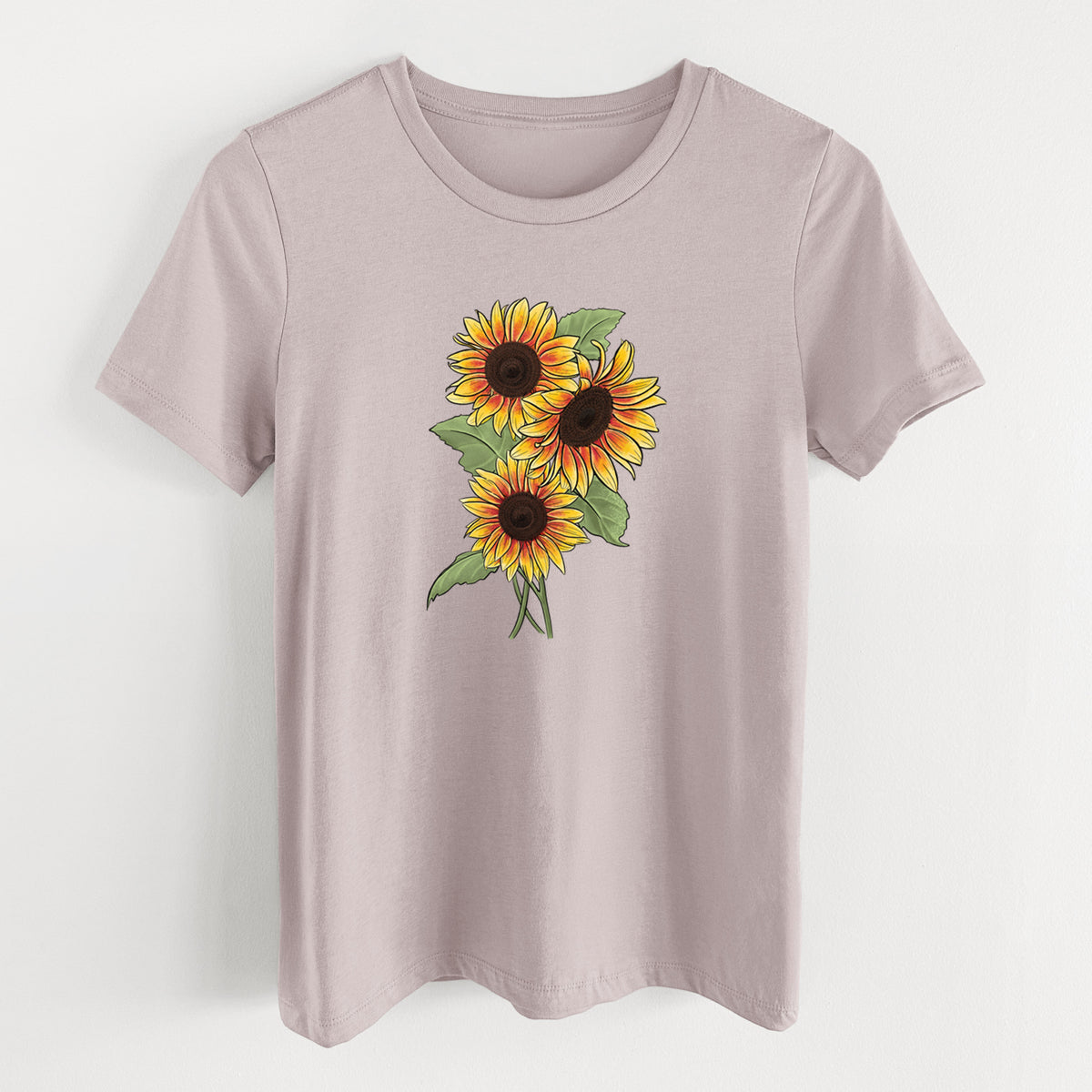 Pink gravel women's relaxed fit cotton t-shirt laid flat, printed with a full-color illustration of a bunch of yellow and orange sunflowers.