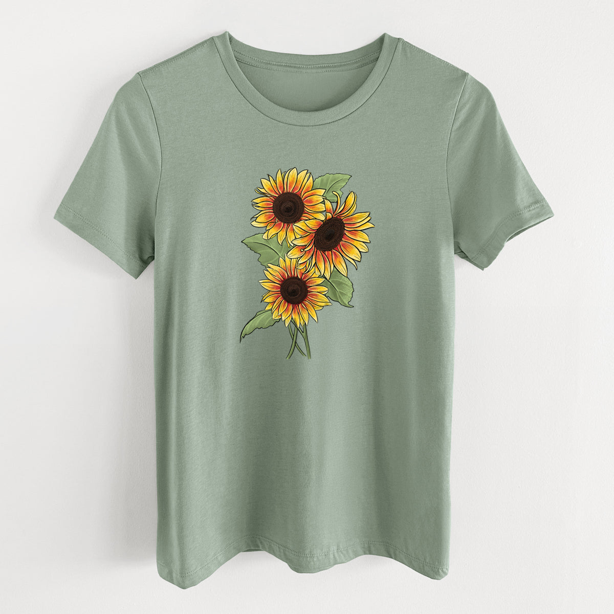 Sage green women's relaxed fit cotton t-shirt laid flat, printed with a full-color illustration of a bunch of yellow and orange sunflowers.