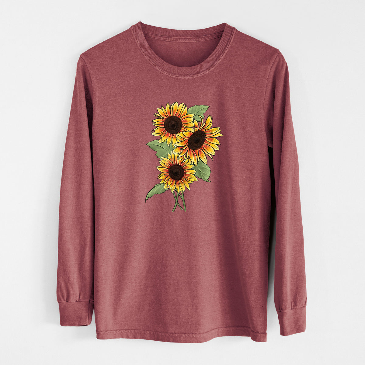 Brick red Comfort Colors long sleeve shirt laid flat, printed with a full-color illustration of a bunch of yellow and orange sunflowers.