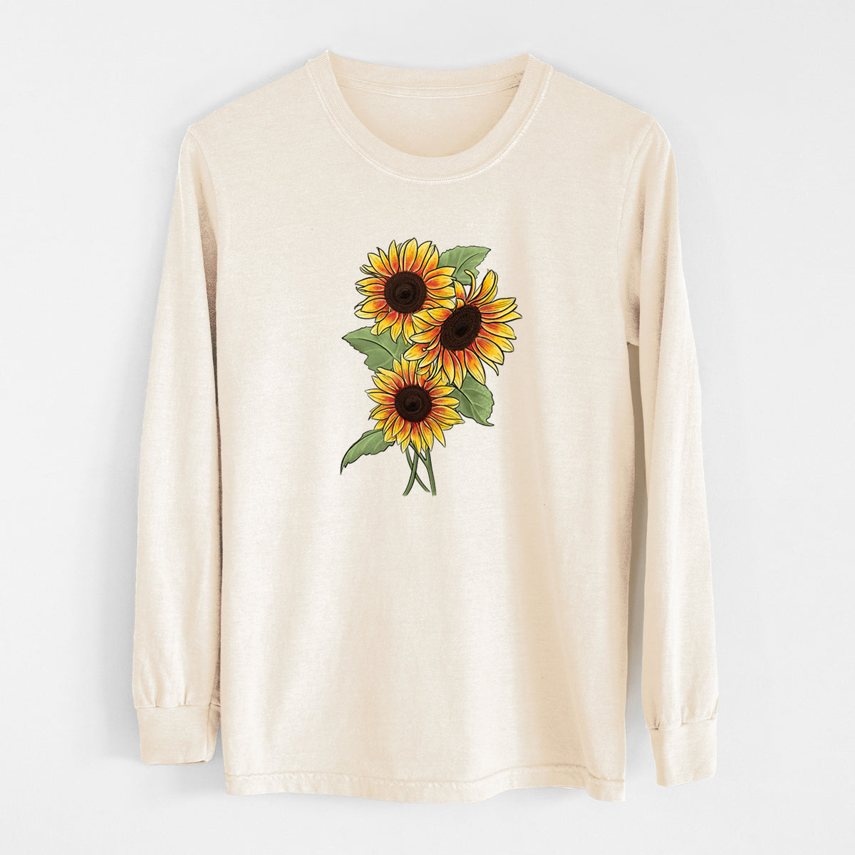 Ivory Comfort Colors long sleeve shirt laid flat, printed with a full-color illustration of a bunch of yellow and orange sunflowers.