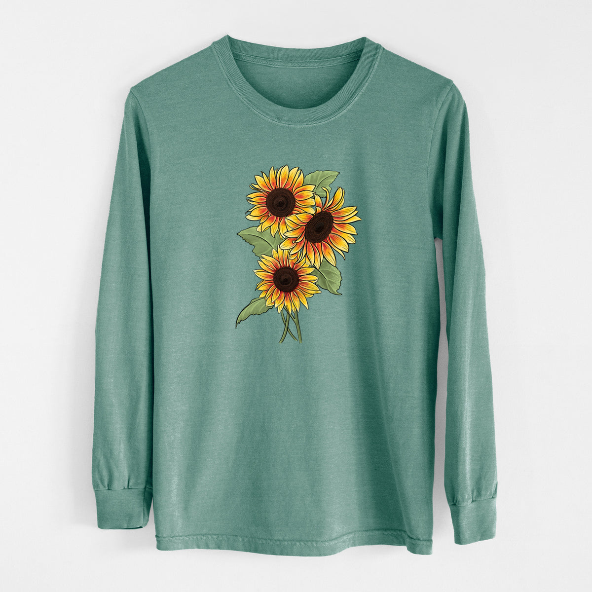 Pine green Comfort Colors long sleeve shirt laid flat, printed with a full-color illustration of a bunch of yellow and orange sunflowers.
