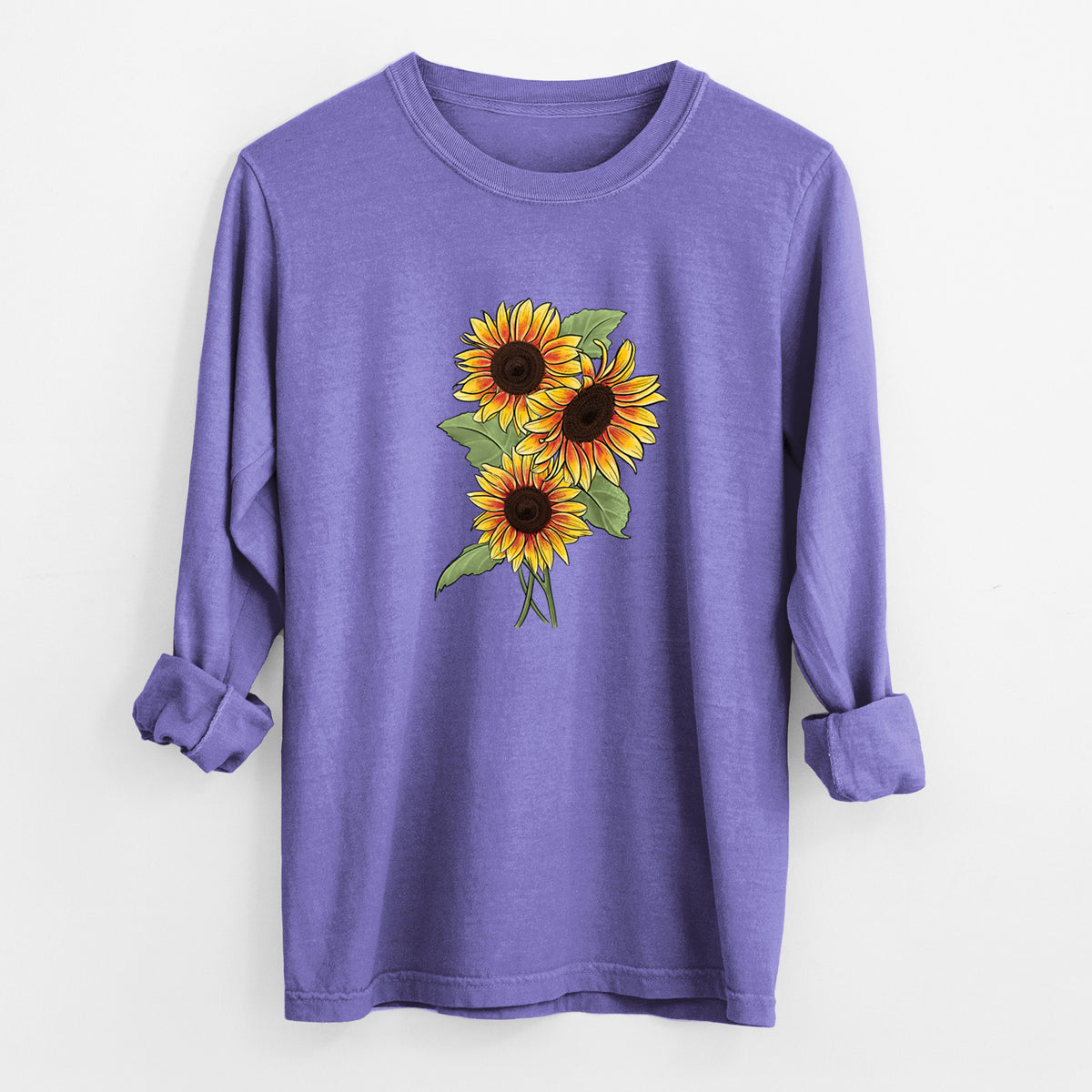 Violet purple Comfort Colors long sleeve shirt laid flat with the cuffs rolled, printed with a full-color illustration of a bunch of yellow and orange sunflowers.