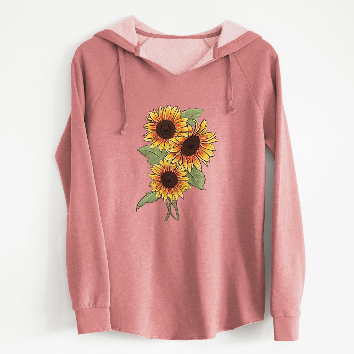 Dusty rose women's Cali Wave hooded sweatshirt laid flat, printed with a full-color illustration of a bunch of yellow and orange sunflowers.