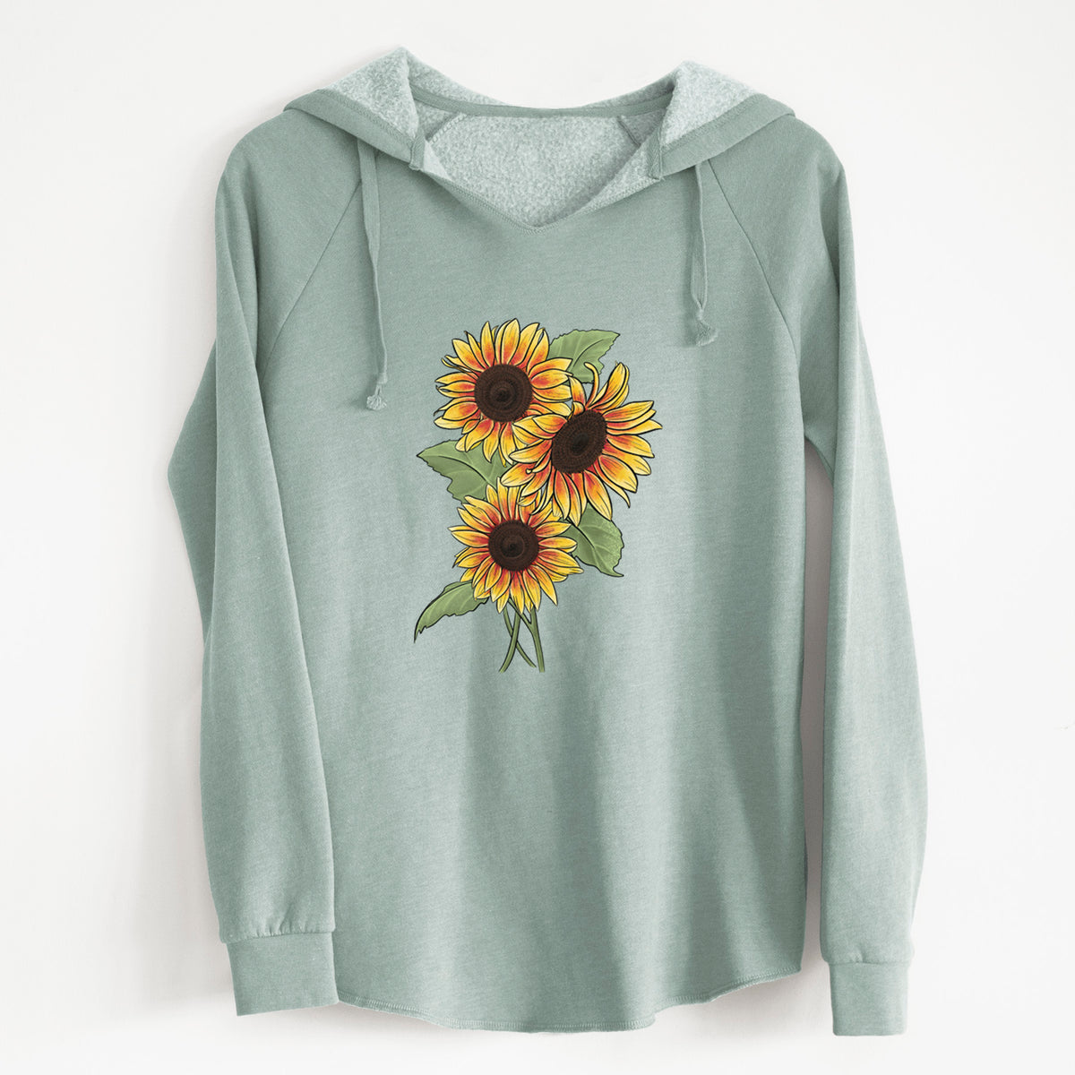 Sage green women's Cali Wave hooded sweatshirt laid flat, printed with a full-color illustration of a bunch of yellow and orange sunflowers.
