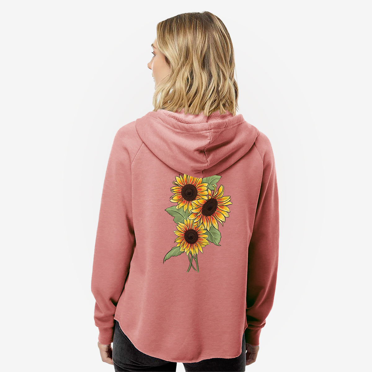 Woman wearing a dusty rose women's Cali Wave zip-up sweatshirt printed with a full-color illustration of a bunch of yellow and orange sunflowers, seen from behind.