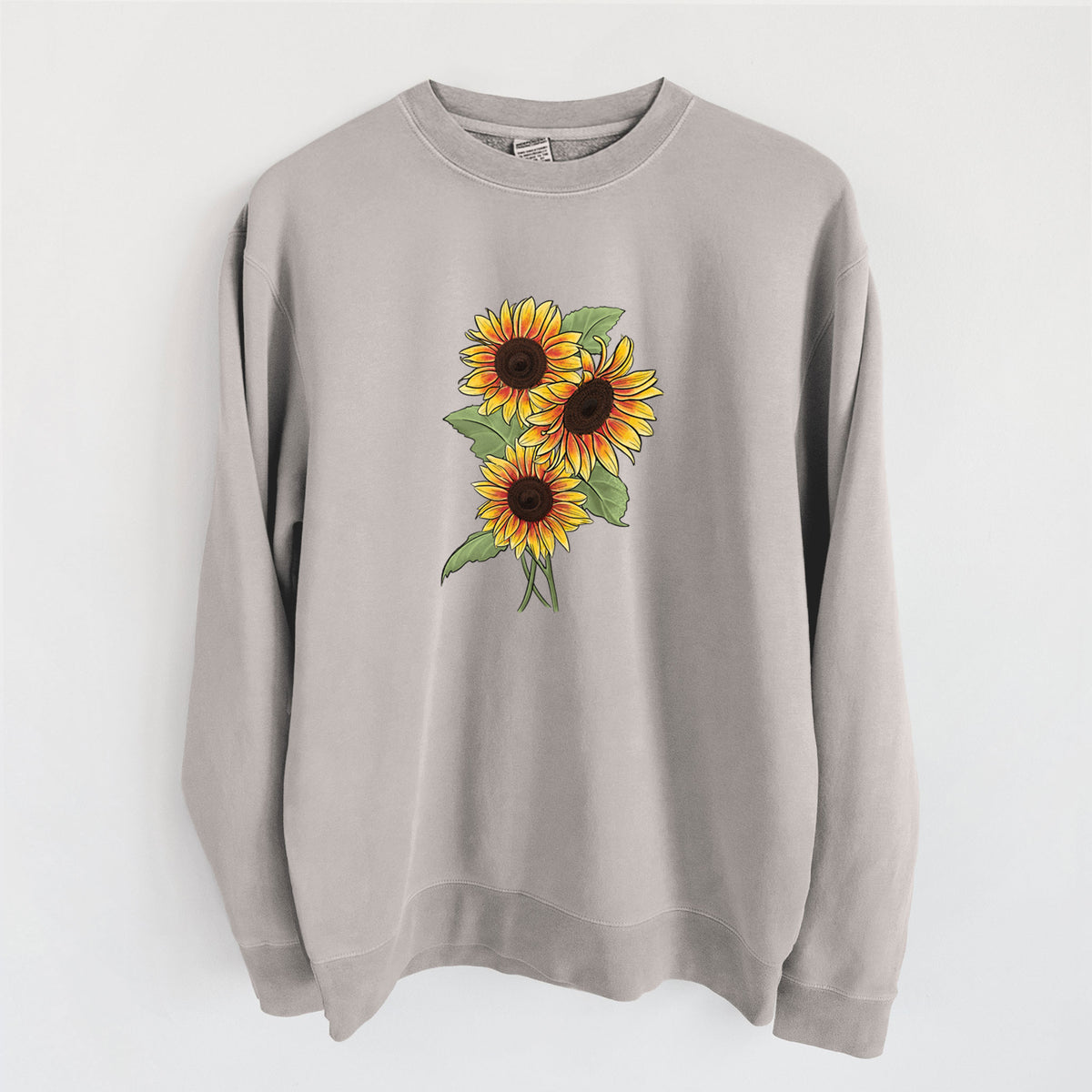 Cement grey pigment dyed crewneck sweatshirt laid flat, printed with a full-color illustration of a bunch of yellow and orange sunflowers.