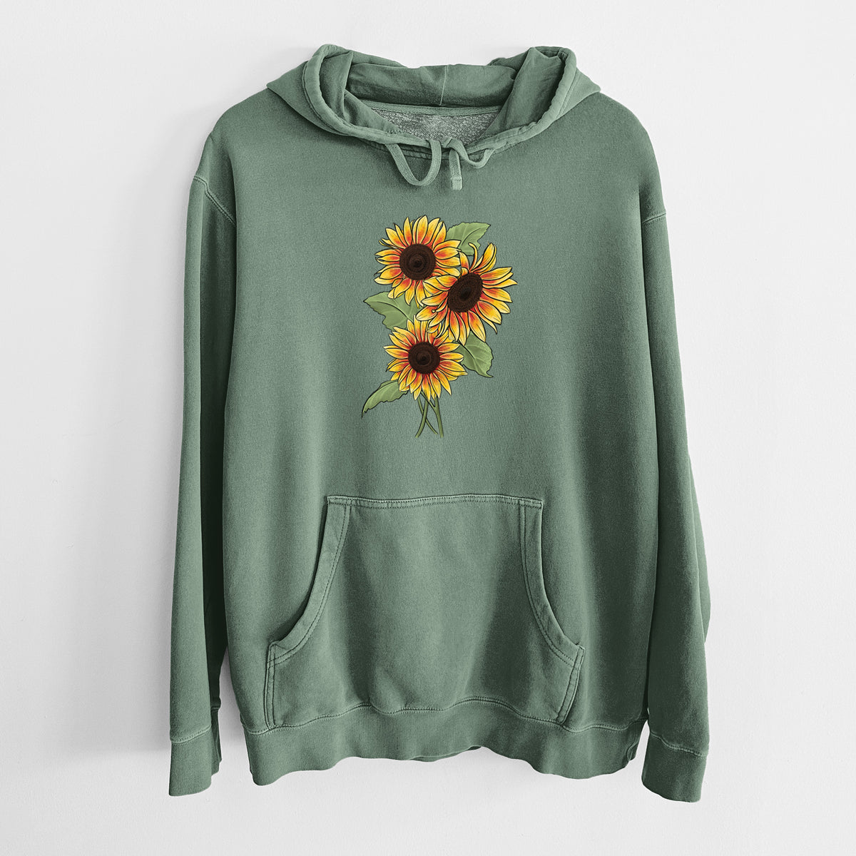 Alpine green pigment dyed hoodie laid flat, printed with a full-color illustration of a bunch of yellow and orange sunflowers.