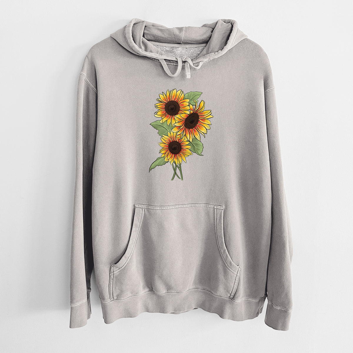 Cement grey pigment dyed hoodie laid flat, printed with a full-color illustration of a bunch of yellow and orange sunflowers.