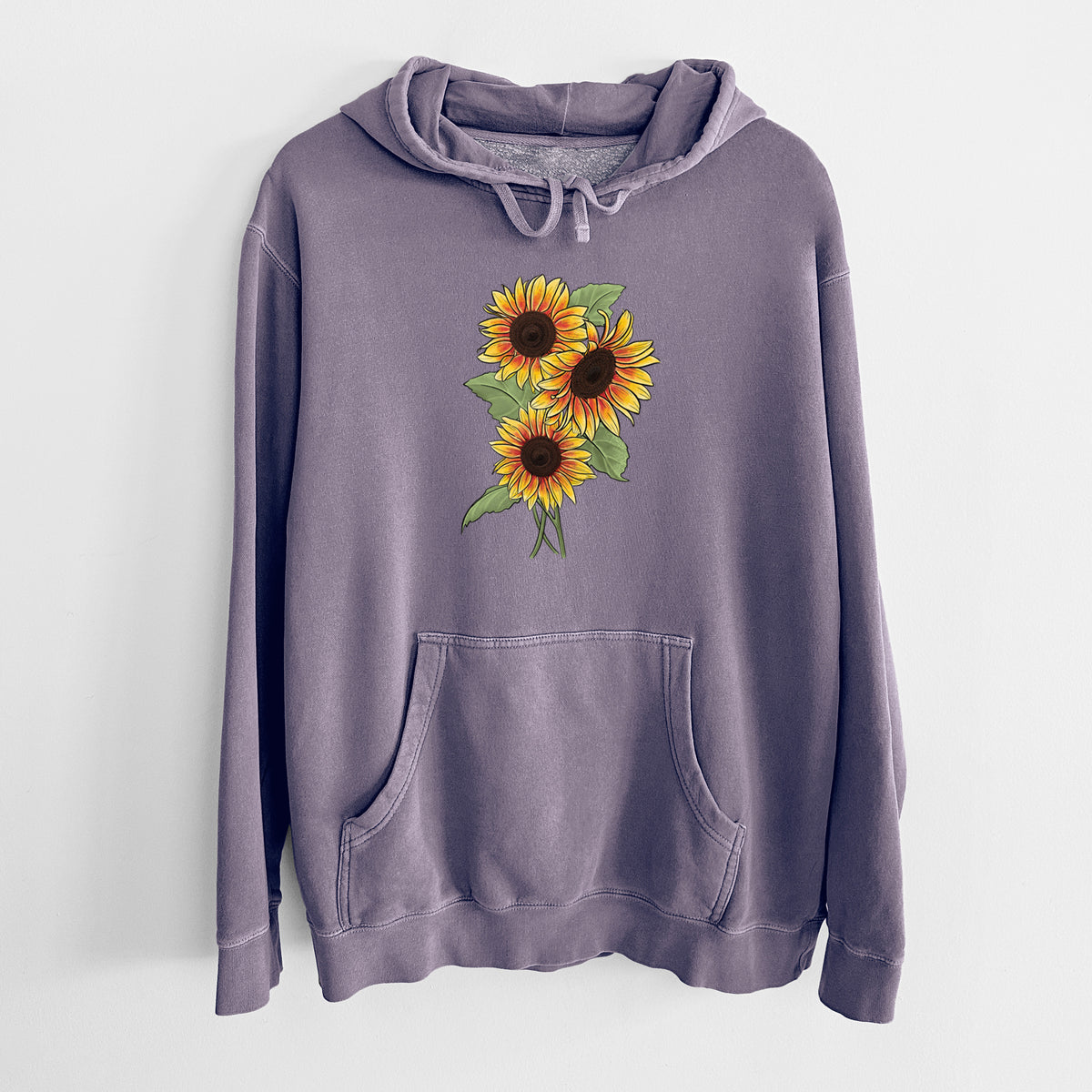 Plum purple pigment dyed hoodie laid flat, printed with a full-color illustration of a bunch of yellow and orange sunflowers.