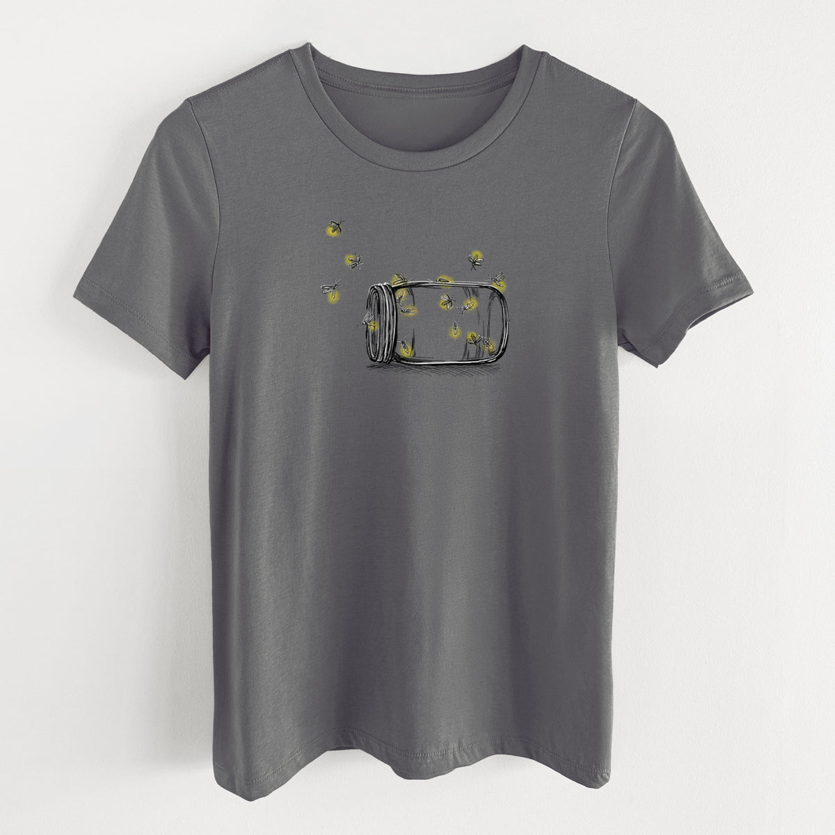 Asphalt women's relaxed fit cotton t-shirt laid flat, printed with a mason jar with glowing yellow fireflies flying out of it.
