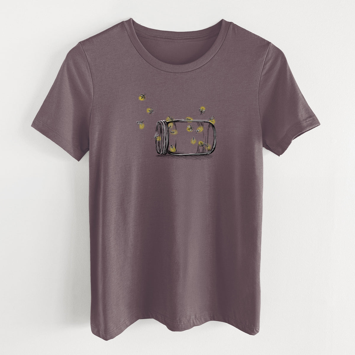 Purple storm women's relaxed fit cotton t-shirt laid flat, printed with a mason jar with glowing yellow fireflies flying out of it.