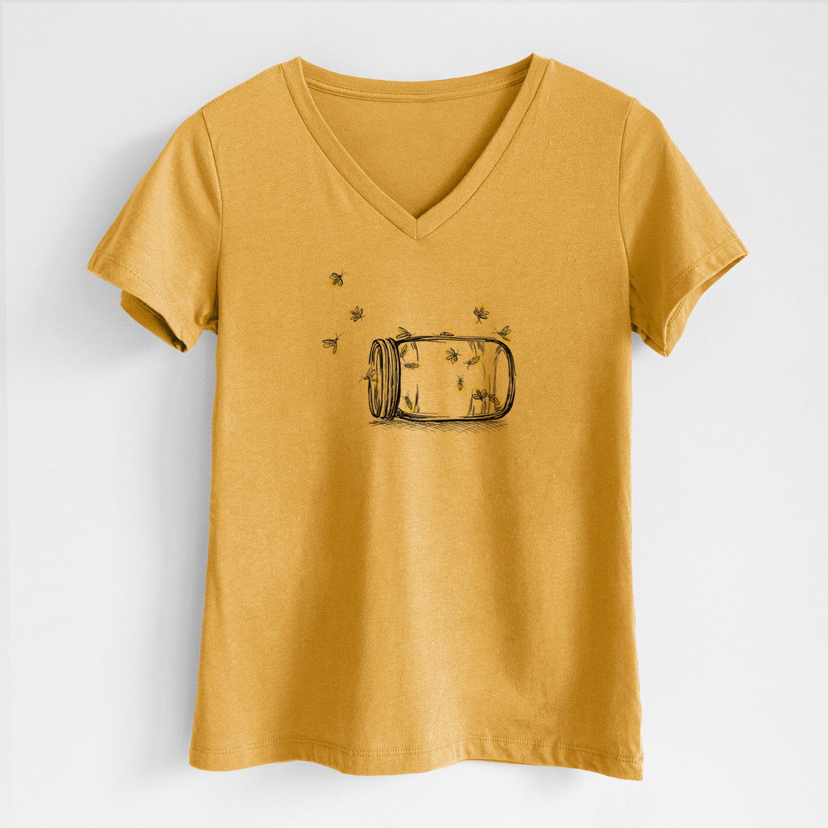 Honeycomb yellow women's relaxed fit cotton V-neck t-shirt laid flat, printed with a mason jar with glowing yellow fireflies flying out of it.