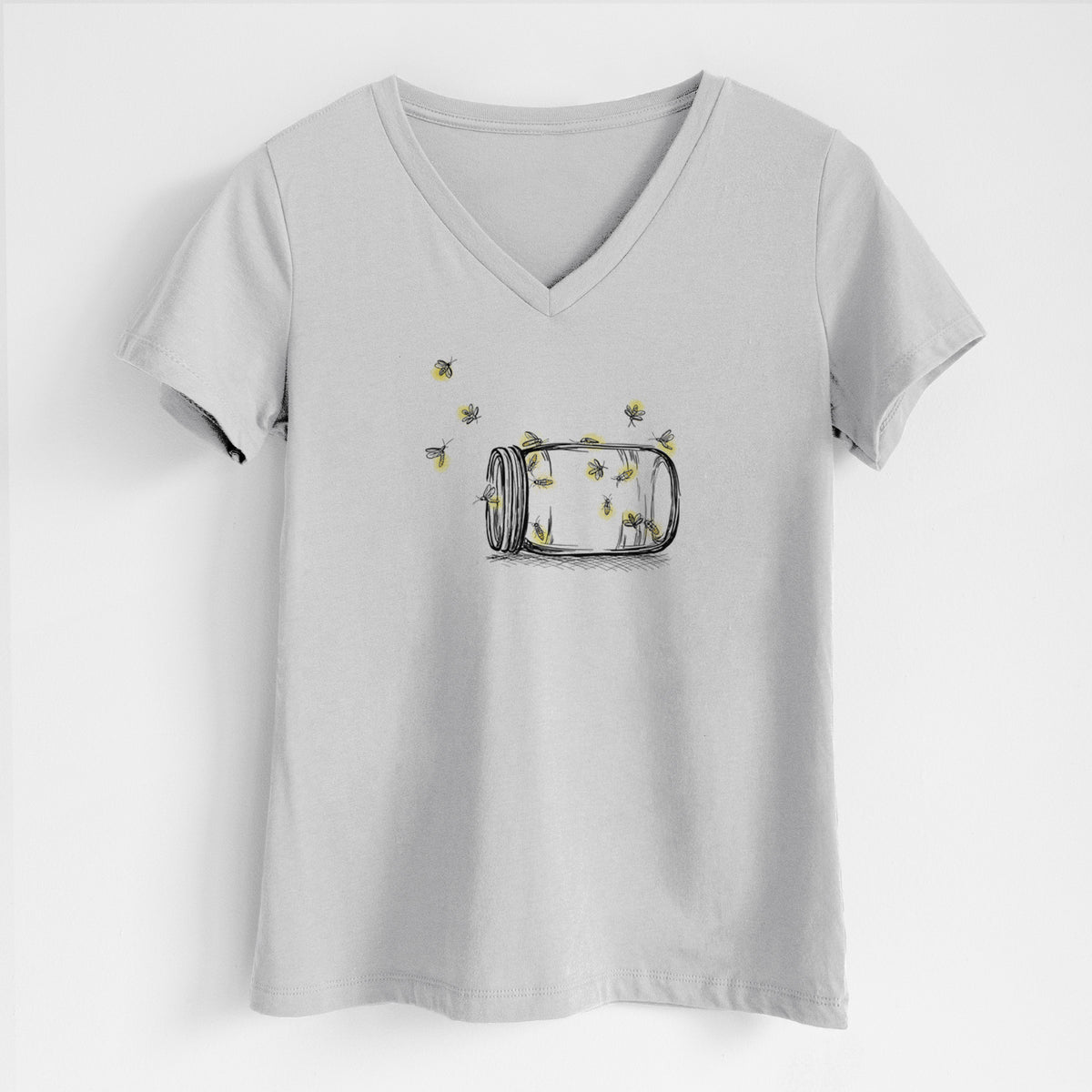 Lunar grey women's relaxed fit cotton V-neck t-shirt laid flat, printed with a mason jar with glowing yellow fireflies flying out of it.