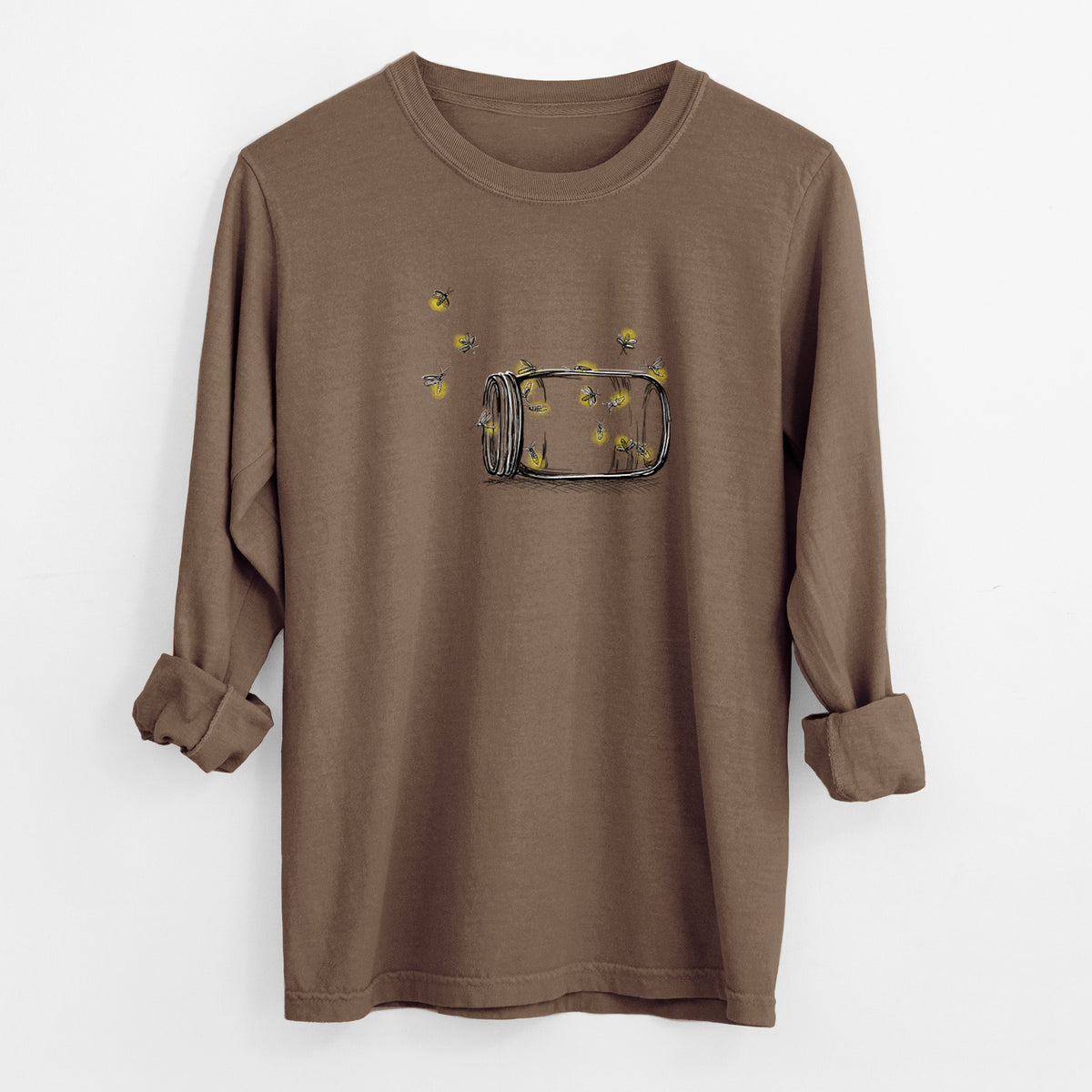 Espresso brown Comfort Colors long sleeve shirt laid flat with the cuffs rolled, printed with a mason jar with glowing yellow fireflies flying out of it.