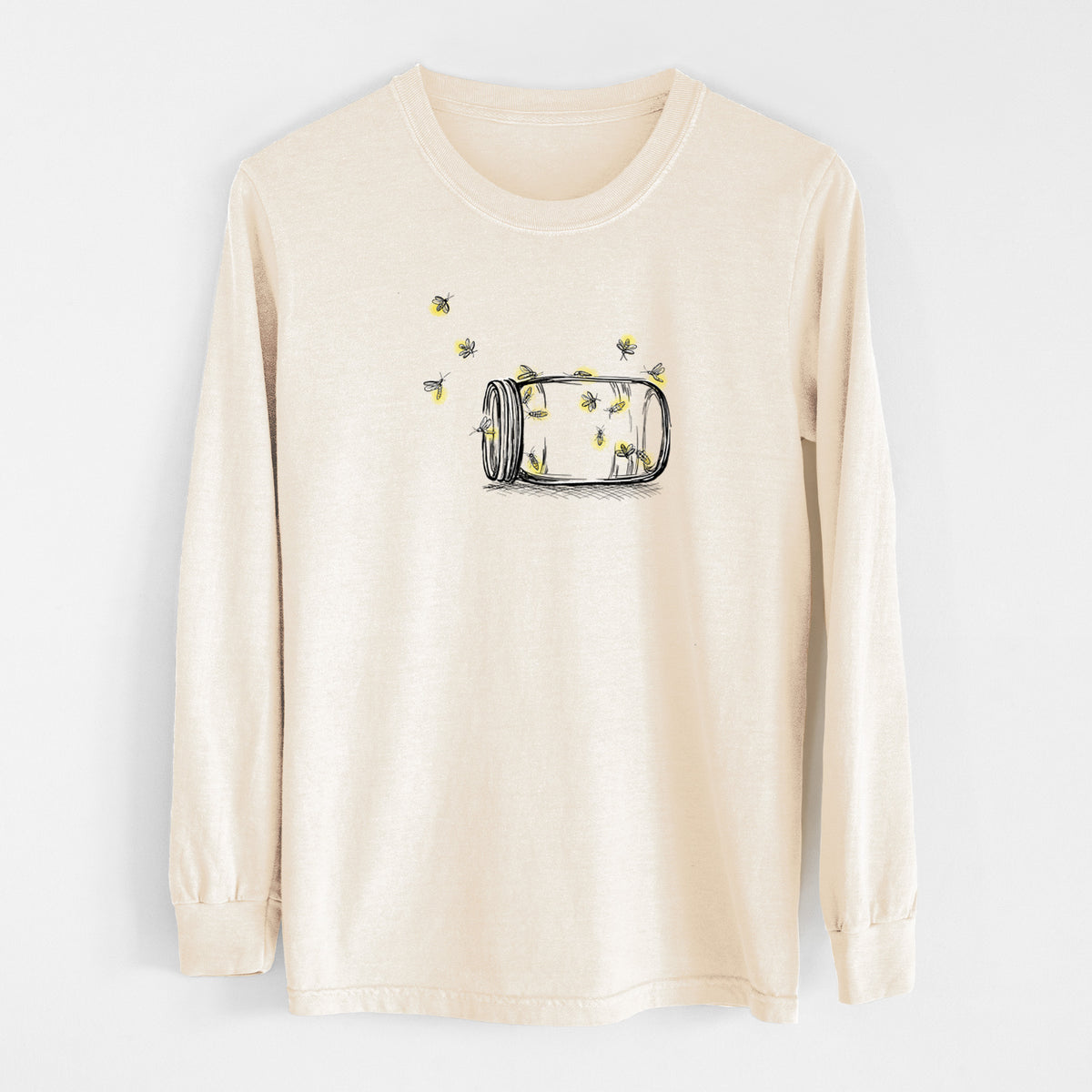 Ivory Comfort Colors long sleeve shirt laid flat, printed with a mason jar with glowing yellow fireflies flying out of it.