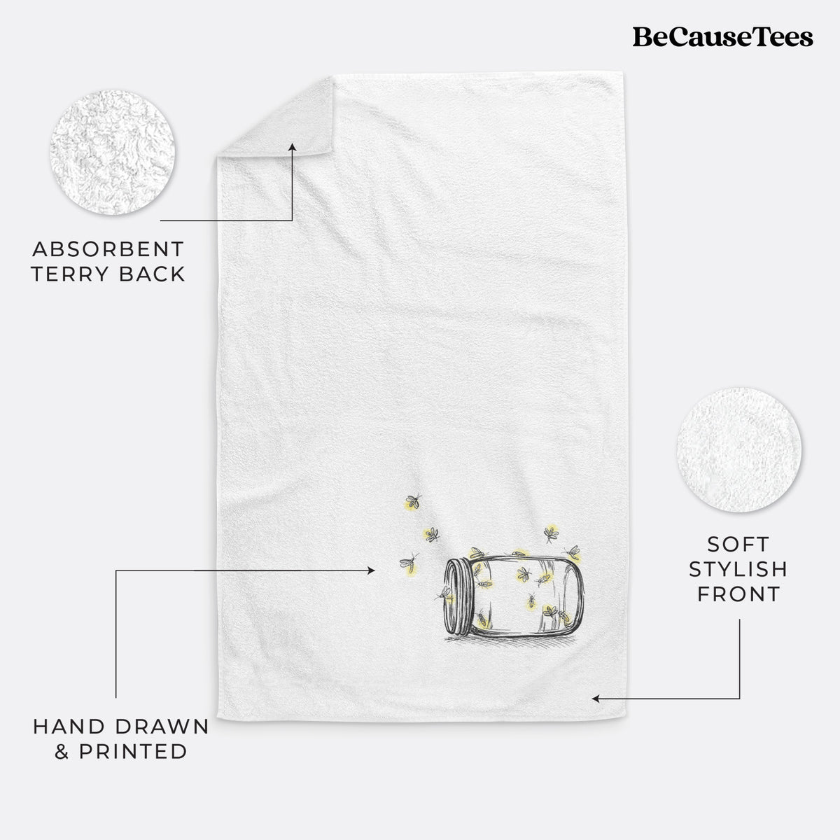 White hand towel printed with a mason jar with glowing yellow fireflies flying out of it.